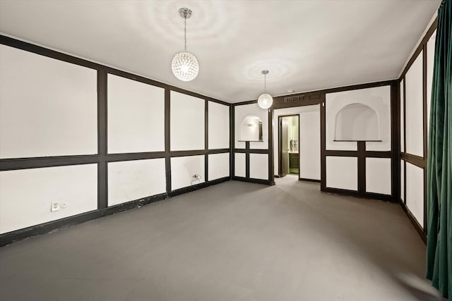 unfurnished room with concrete floors