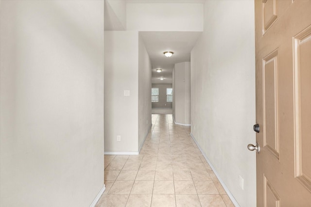 hallway with light tile patterned floors