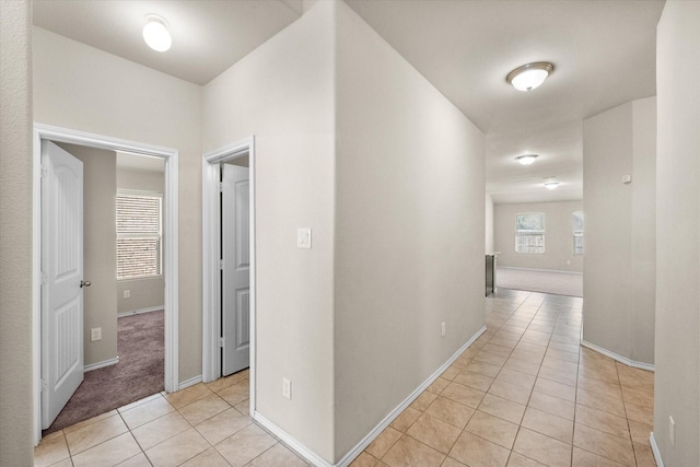 hallway with light tile patterned flooring