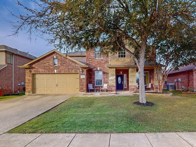 view of front of home featuring a front yard, central AC, and a garage