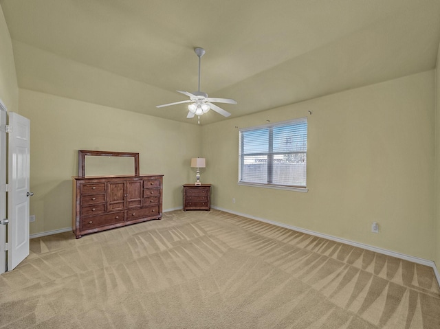 unfurnished bedroom featuring ceiling fan and light colored carpet