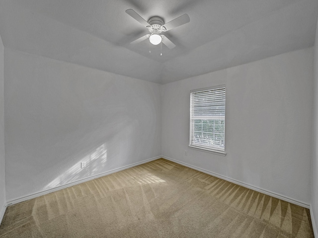 spare room with carpet flooring and ceiling fan