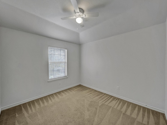 empty room featuring carpet flooring and ceiling fan