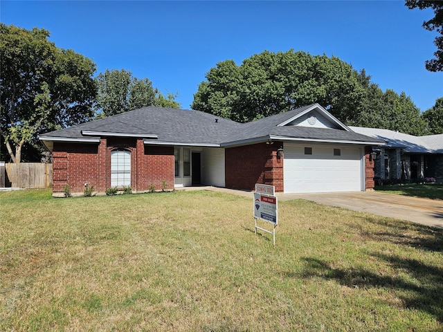 ranch-style house featuring a front lawn and a garage