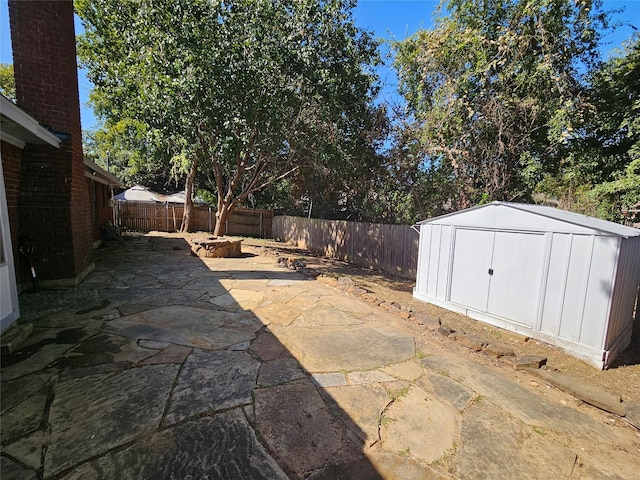 view of patio featuring a shed