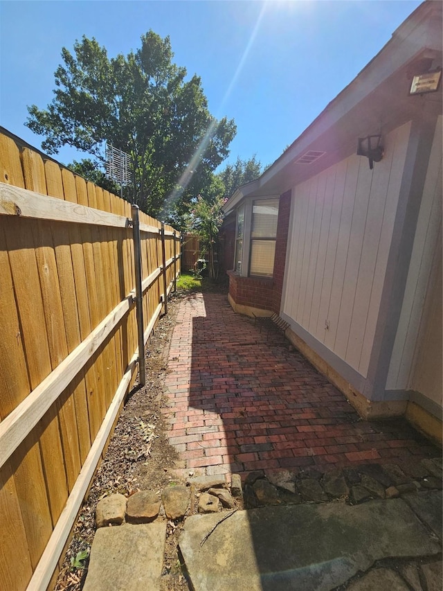 view of side of home with a patio area