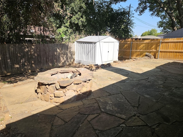 view of patio / terrace featuring a shed