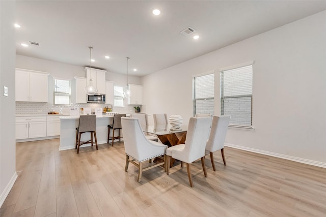 4557 Ward St, North Richland Hills, TX 76180 - dining room featuring baseboards, visible vents, light wood-style flooring, and recessed lighting