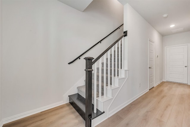 4557 Ward St, North Richland Hills, TX 76180 - stairway with baseboards, wood finished floors, and recessed lighting