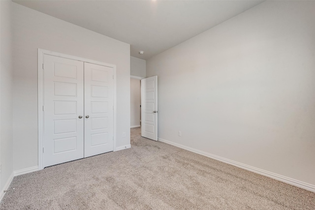 4557 Ward St, North Richland Hills, TX 76180 - unfurnished bedroom with carpet flooring, baseboards, and a closet