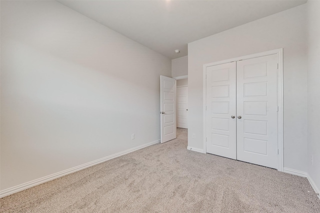 4557 Ward St, North Richland Hills, TX 76180 - unfurnished bedroom with baseboards, carpet flooring, and a closet