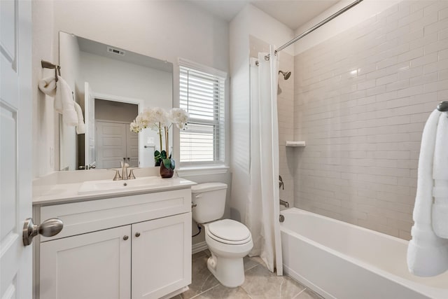 4557 Ward St, North Richland Hills, TX 76180 - bathroom featuring vanity, toilet, tile patterned floors, visible vents, and shower / bath combo