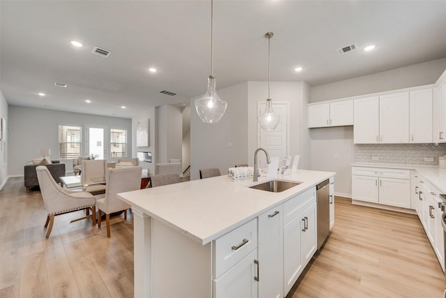 4557 Ward St, North Richland Hills, TX 76180 - kitchen featuring stainless steel dishwasher, visible vents, and a sink