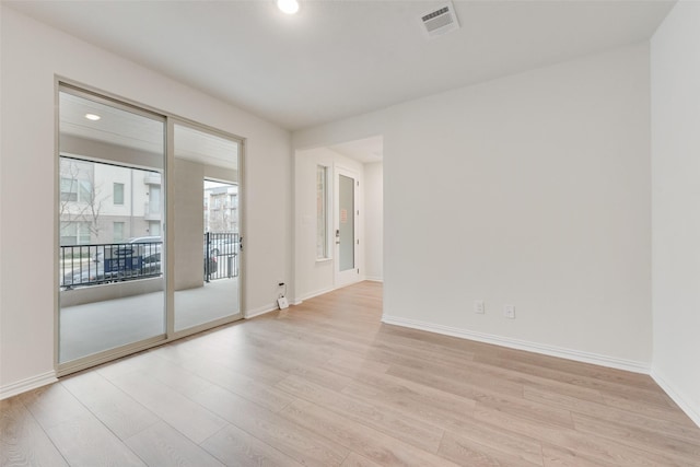 unfurnished room featuring light hardwood / wood-style flooring