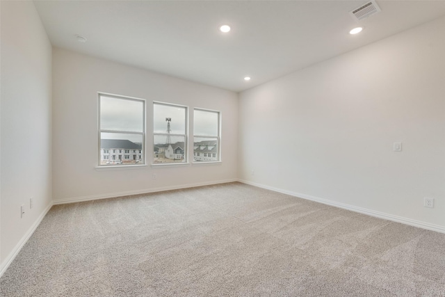 unfurnished room with carpet flooring