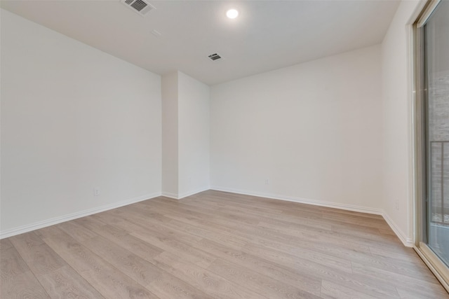 unfurnished room featuring light wood-type flooring