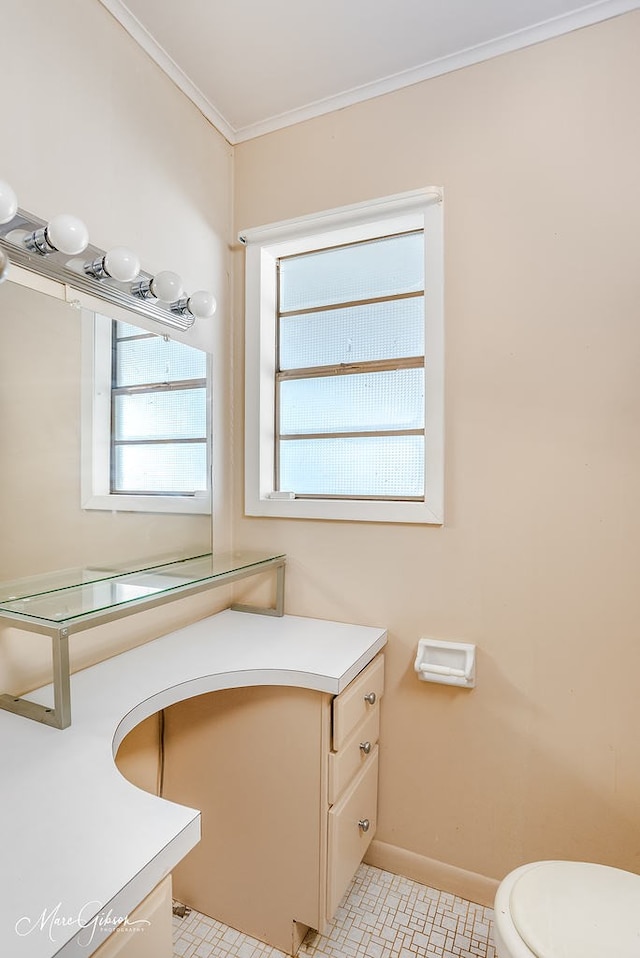 bathroom featuring tile patterned floors, ornamental molding, toilet, and vanity