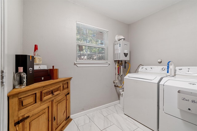 washroom featuring washer and dryer and tankless water heater