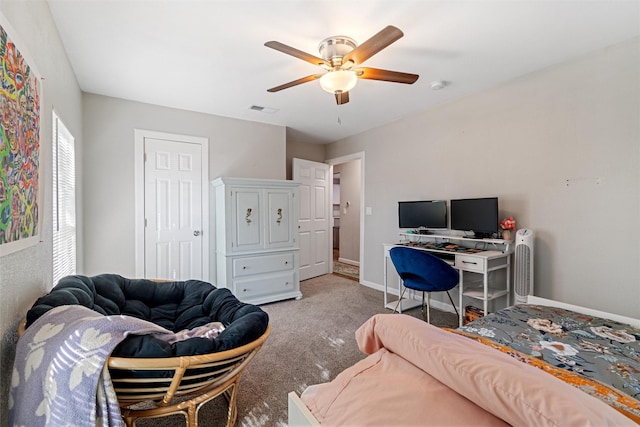 carpeted bedroom with ceiling fan