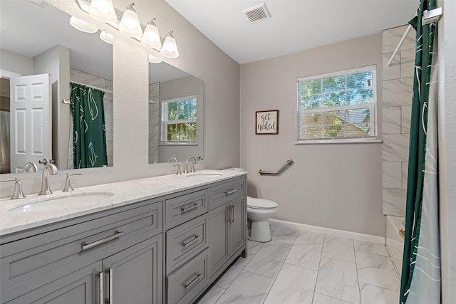 full bathroom featuring vanity, shower / tub combo, and toilet