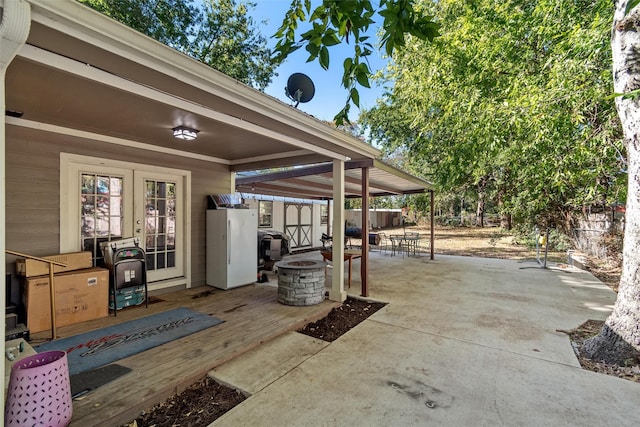 view of patio / terrace featuring an outdoor fire pit