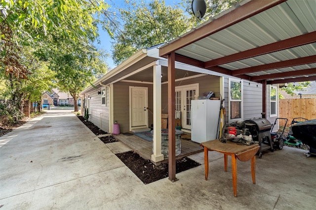 view of patio / terrace with a grill and french doors