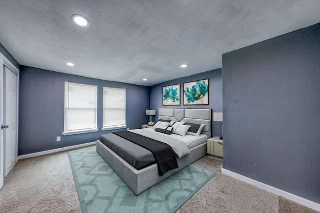 carpeted bedroom with a textured ceiling