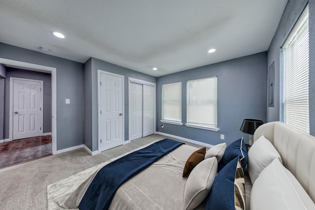 bedroom featuring light colored carpet