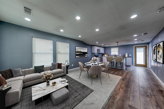 living room featuring dark hardwood / wood-style floors