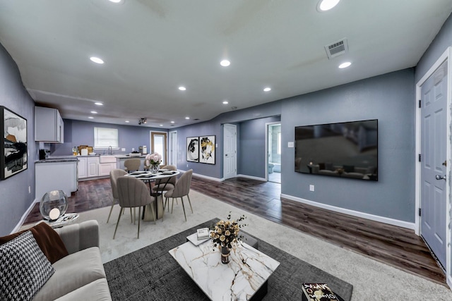 living room with dark hardwood / wood-style flooring