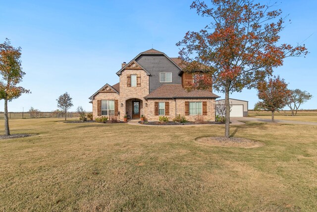 craftsman inspired home featuring a front lawn