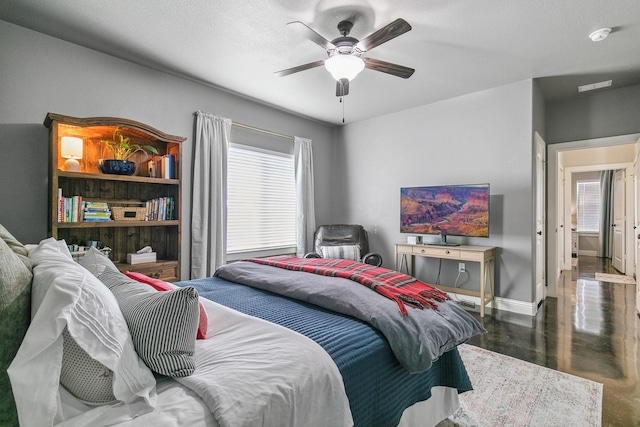 bedroom featuring a textured ceiling and ceiling fan