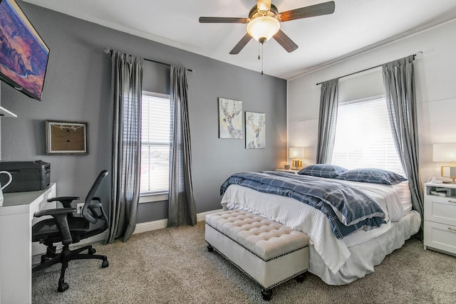 bedroom featuring ceiling fan and light carpet