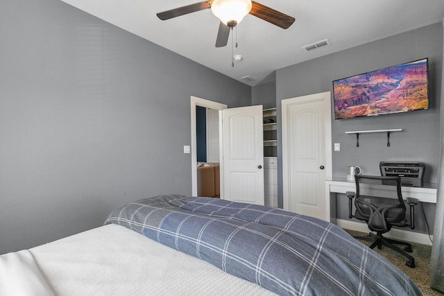 carpeted bedroom featuring ceiling fan, lofted ceiling, and a closet