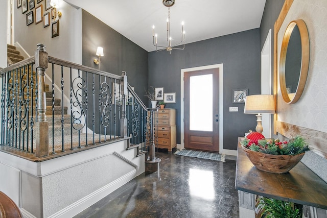 foyer entrance with a chandelier