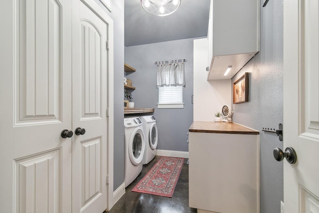 laundry room with washing machine and dryer and dark hardwood / wood-style flooring