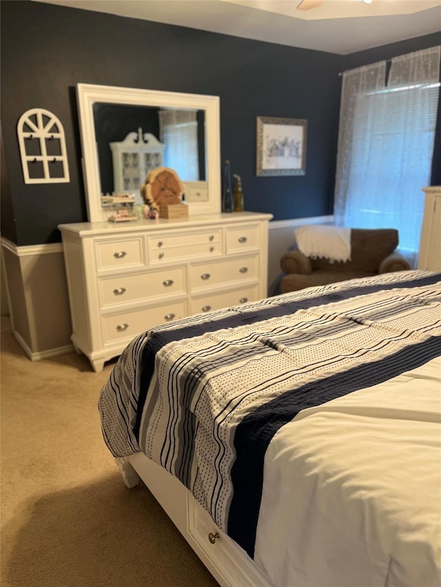 bedroom with light colored carpet