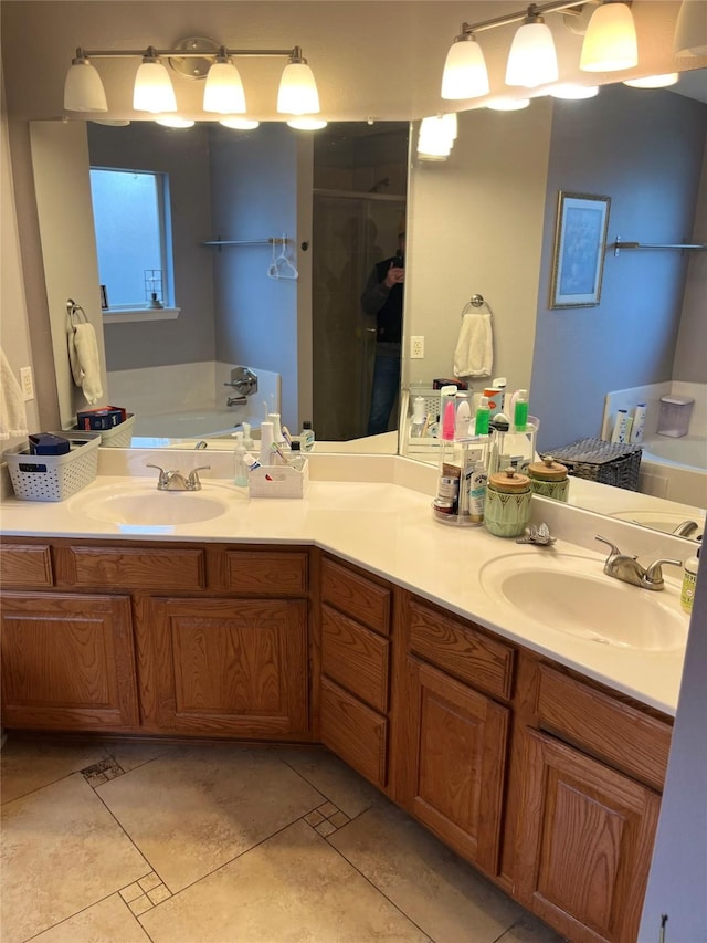 bathroom with tile patterned flooring, vanity, and separate shower and tub