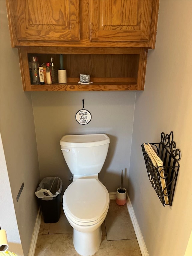 bathroom featuring tile patterned floors and toilet