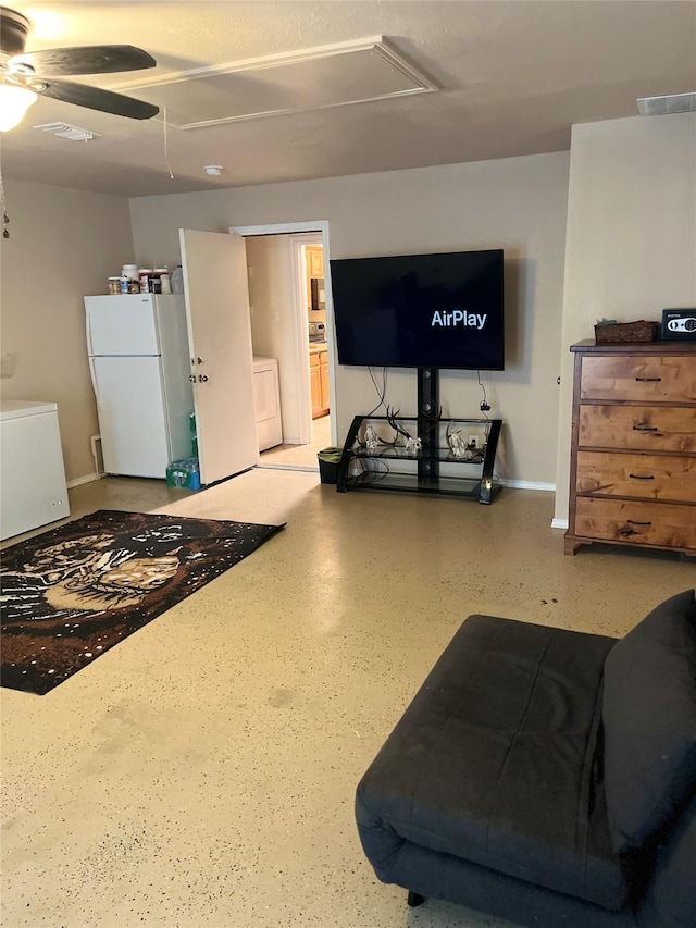 living room with washer / dryer and ceiling fan