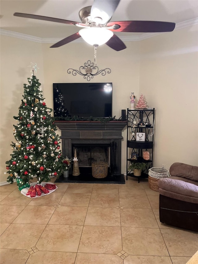 living room with ceiling fan, tile patterned flooring, and ornamental molding