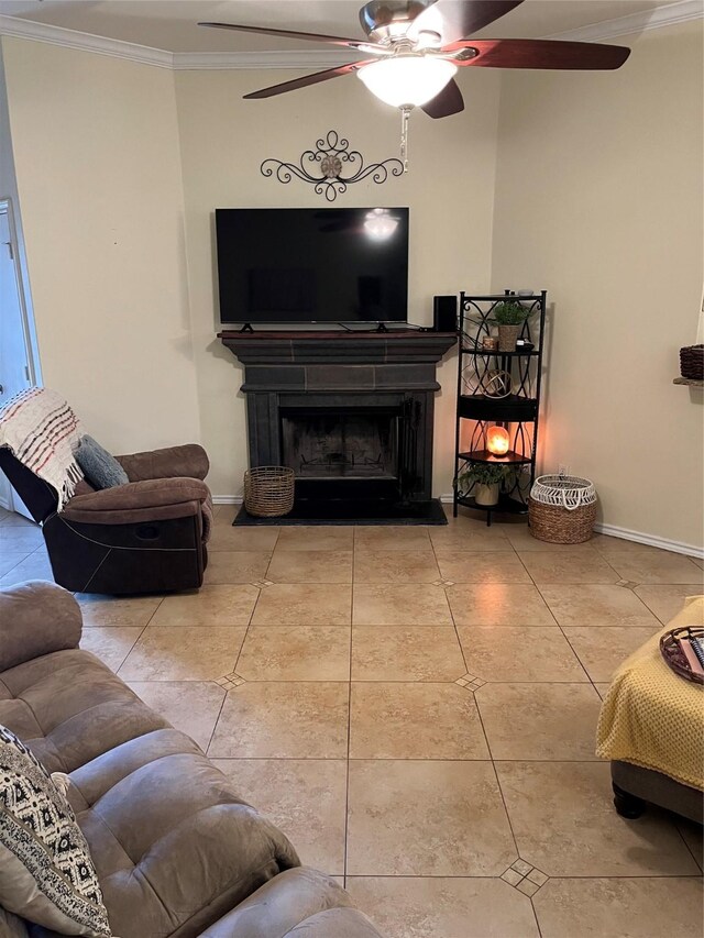 living room with light tile patterned floors, ceiling fan, and crown molding