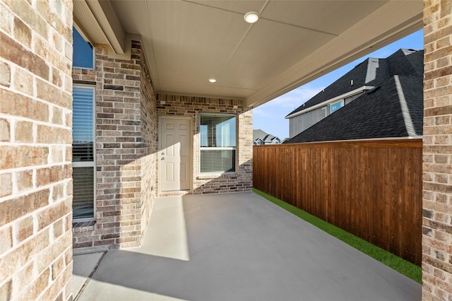 view of patio featuring fence