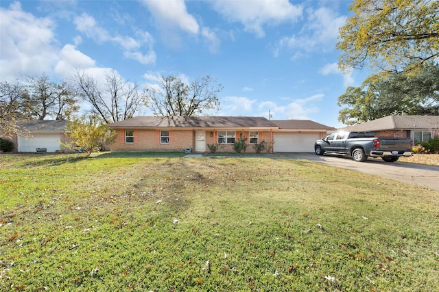 ranch-style house featuring a garage and a front yard