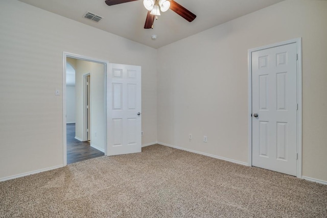 unfurnished bedroom with carpet floors and ceiling fan