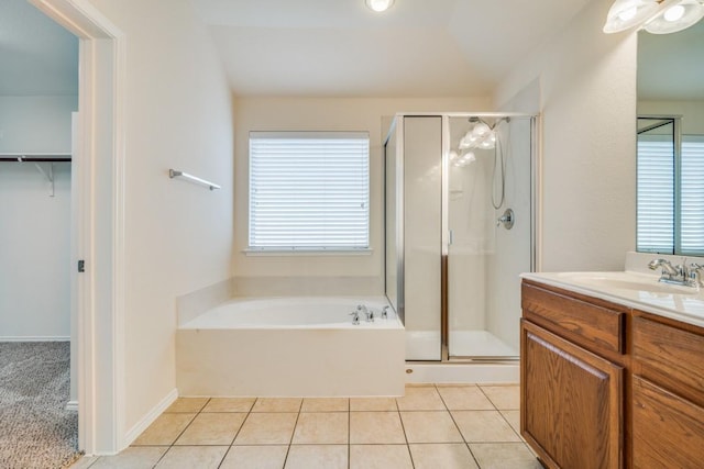 bathroom with tile patterned flooring, vanity, and independent shower and bath