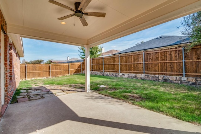 view of patio featuring ceiling fan