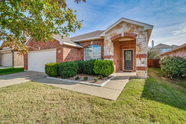 view of front of house featuring a front yard and a garage