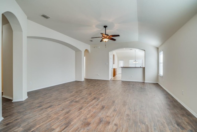 unfurnished living room with ceiling fan and wood-type flooring