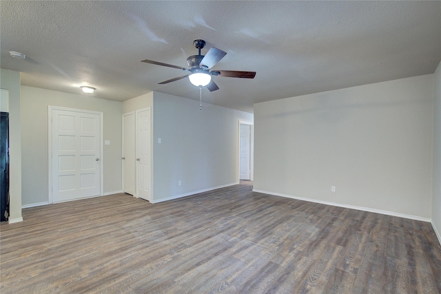 unfurnished room featuring ceiling fan, a textured ceiling, and hardwood / wood-style flooring